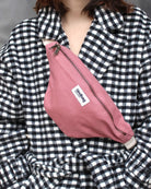 a woman in a dress shirt and a red tie 