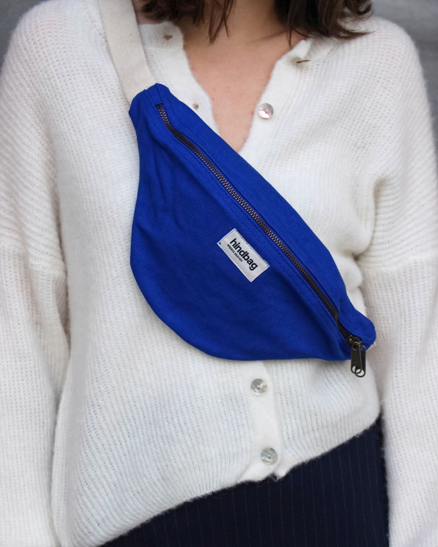 a woman in a white shirt and blue tie 