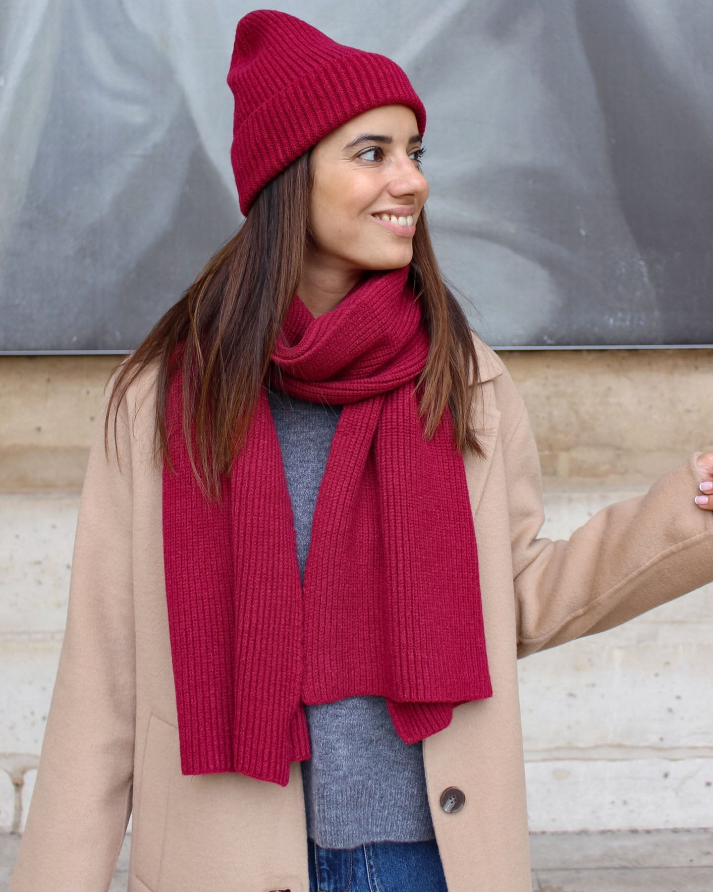 a woman wearing a red hat and a hat 