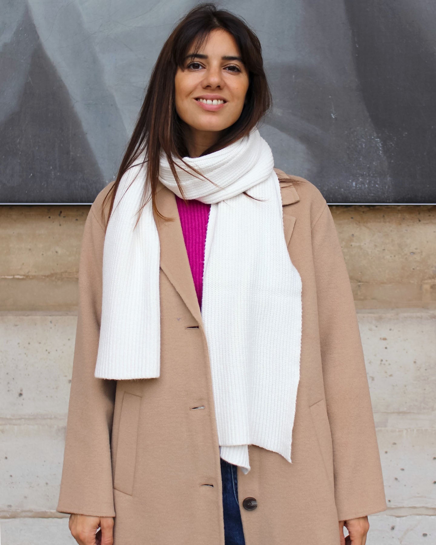 a woman in a white dress shirt and tie 