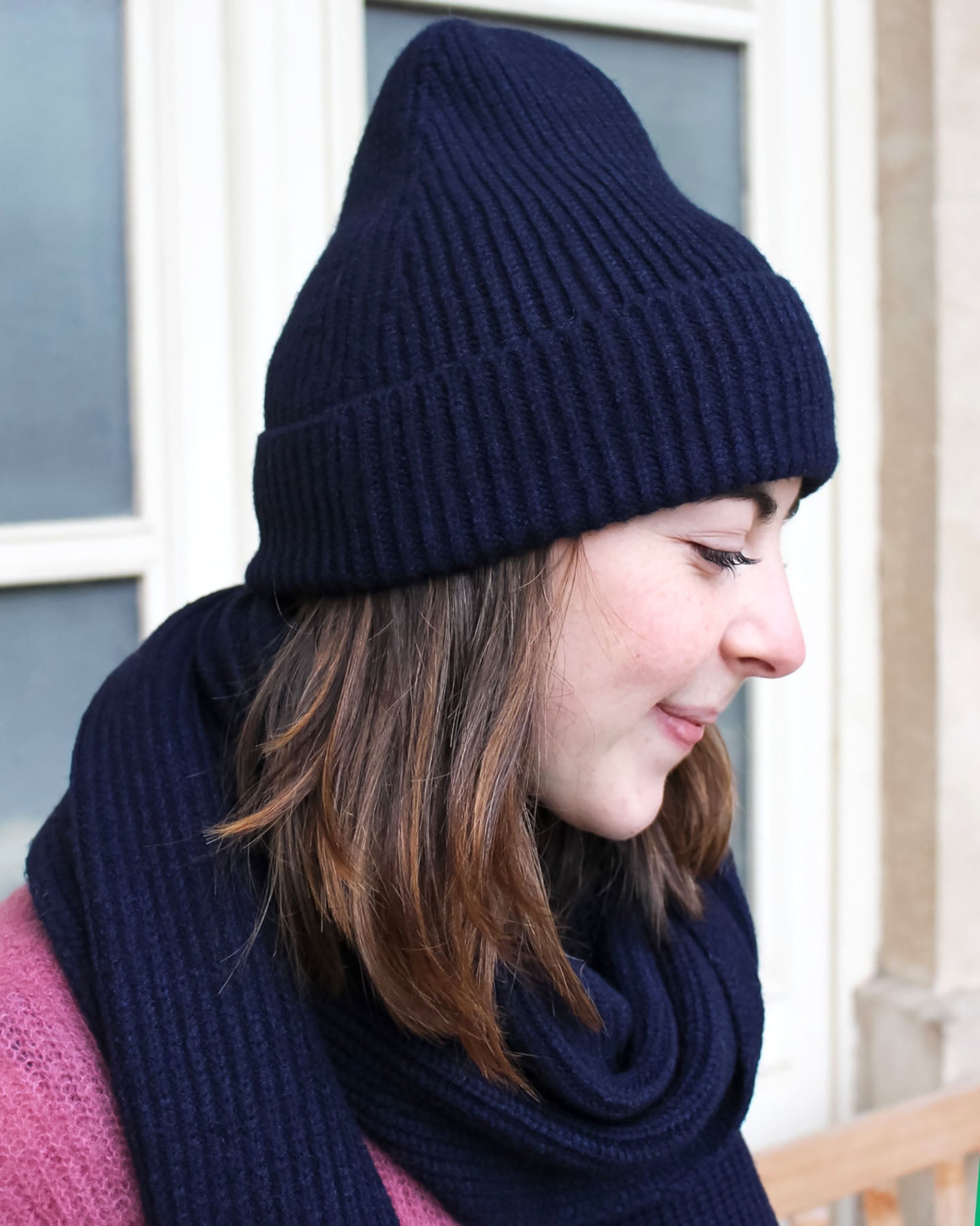 a woman wearing a hat and a hat 