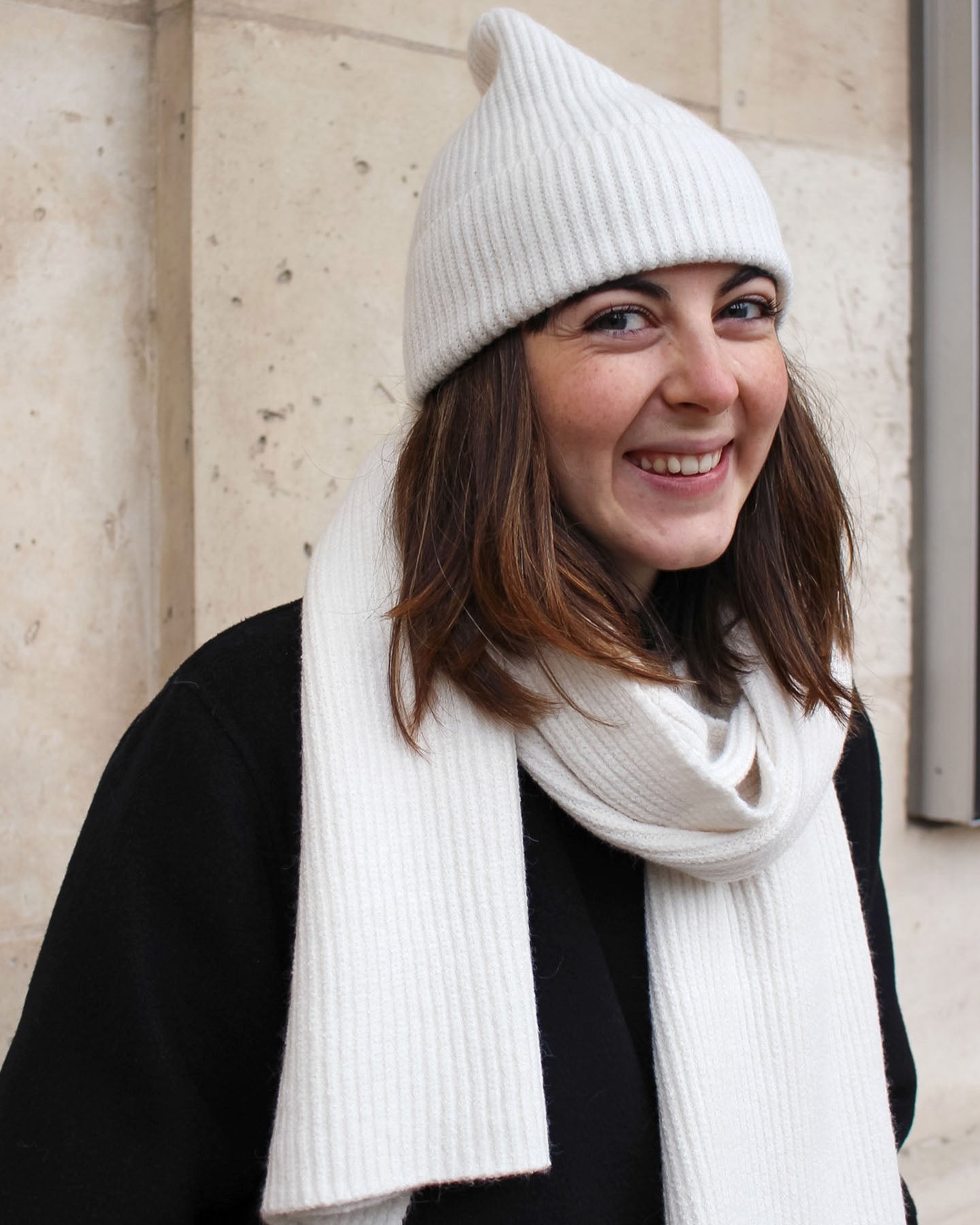 a woman wearing a hat and a hat 