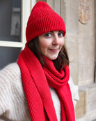 a girl wearing a red hat and a red hat 