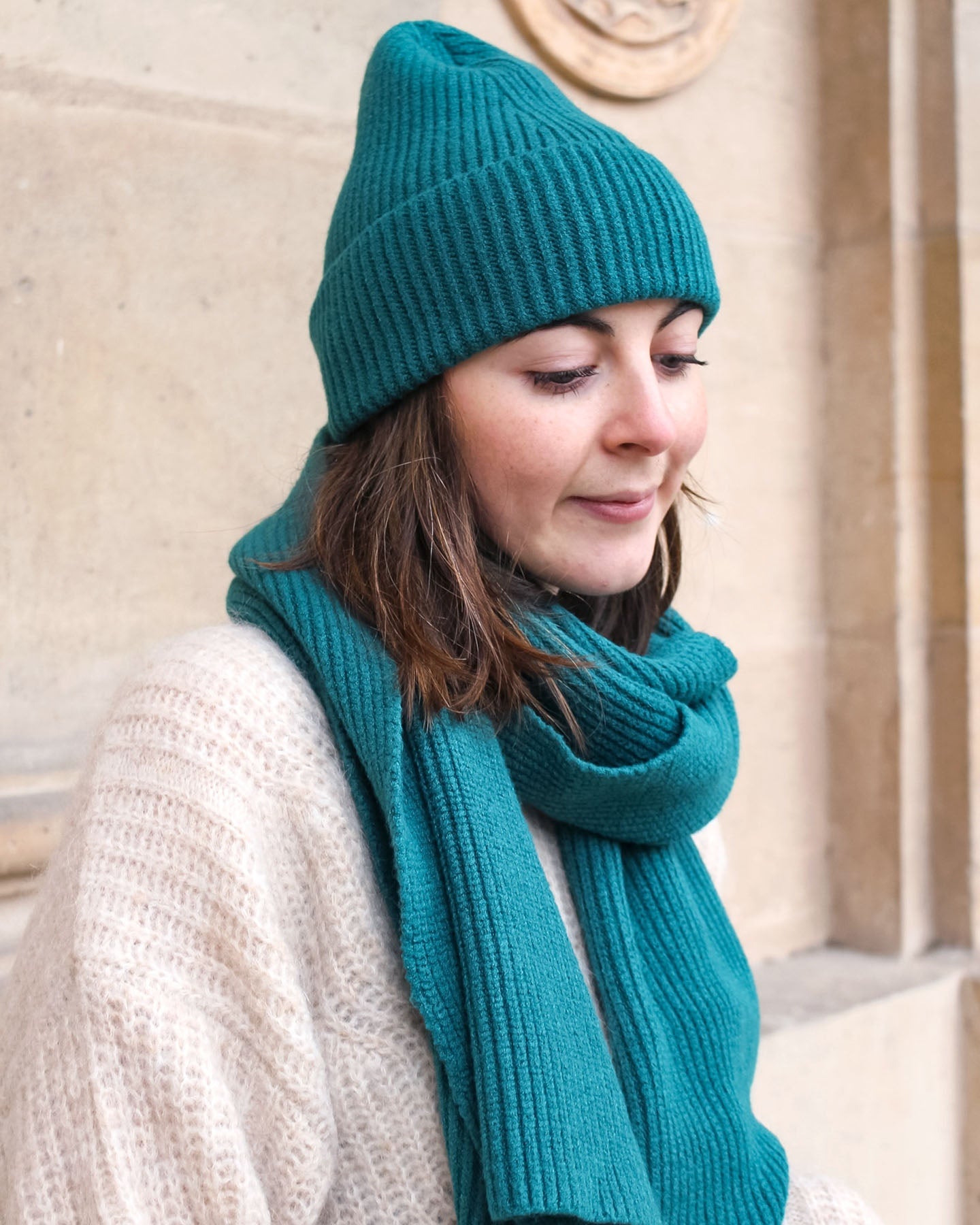 a woman wearing a hat and a hat 