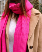 a woman wearing a pink dress and a pink dress 