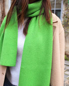 a woman in a green dress shirt and tie 