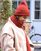 a man wearing a red hat talking on a cell phone 